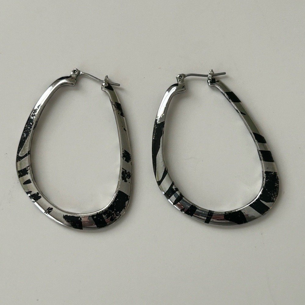 Lia Sophia “Instinct” hoop earrings. Black/silver animal print.
